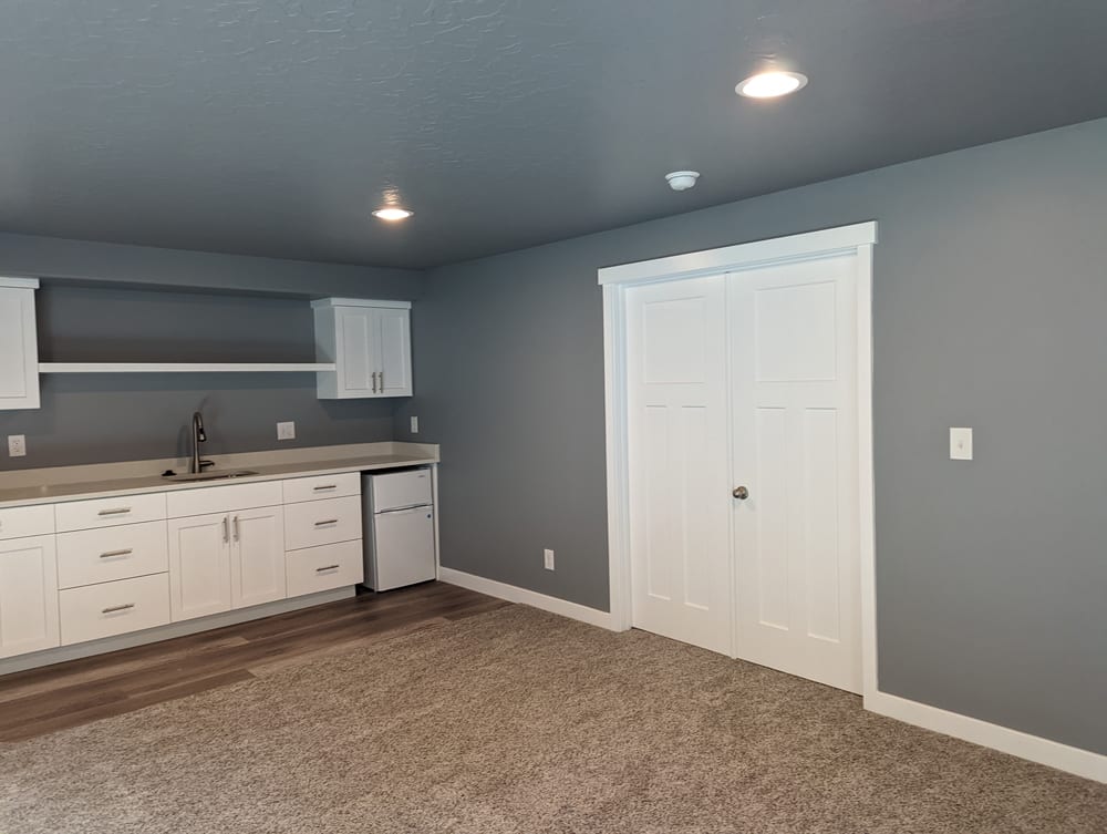 PXL_20220601_145246627 Large basement with a modern interior design in bright lighting