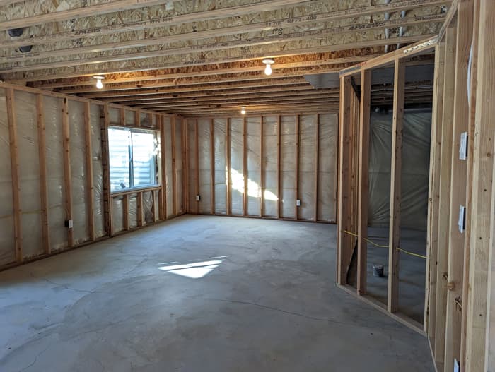 PXL_20230213_223735190 Large basement with a modern interior design in bright lighting