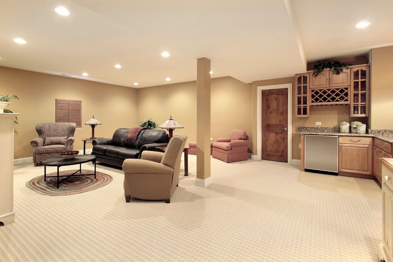 Bright and tidy living room with attached kitchen, plus basement kitchenette and renovation.